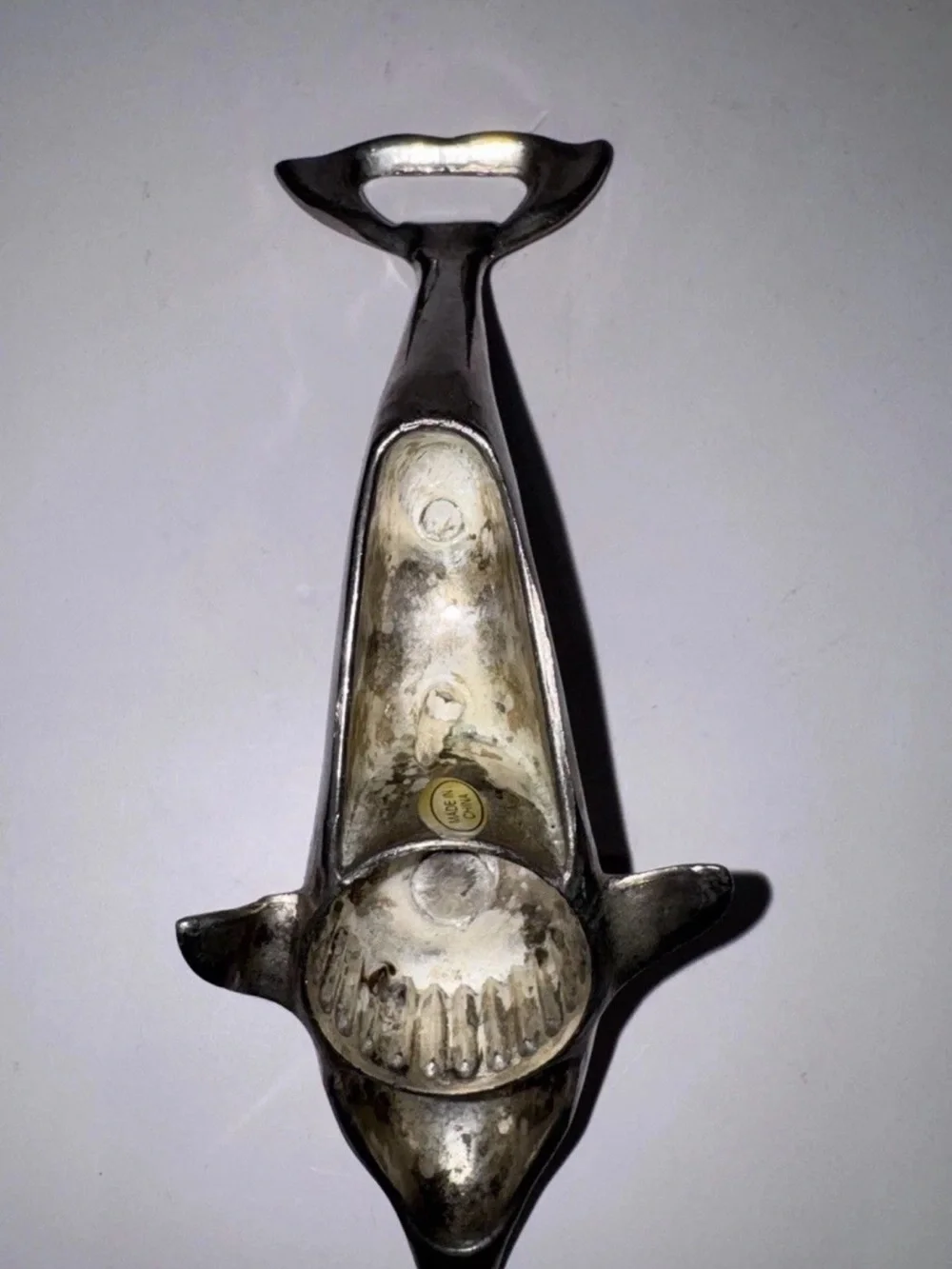 Sleek silver-plated Dolphin bottle opener